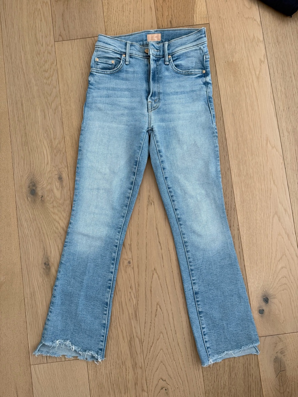 MOTHER Light Blue Flare Jeans with Raw Hem